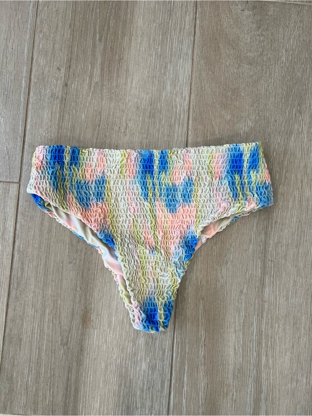 Aila Blue Smocked Tie-Dye Bikini Bottom in Blue, Pink & Yellow, size small.